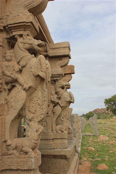 Horse pillars at entrance to water tank in Hampi by Dinesh Kannambadi